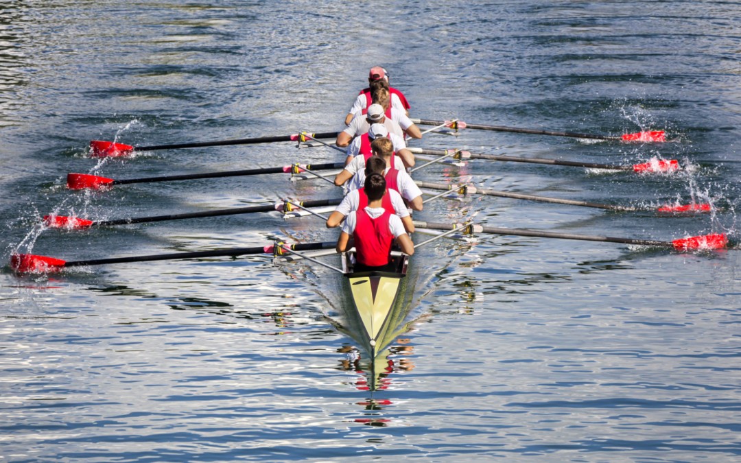 rowers in boat on water